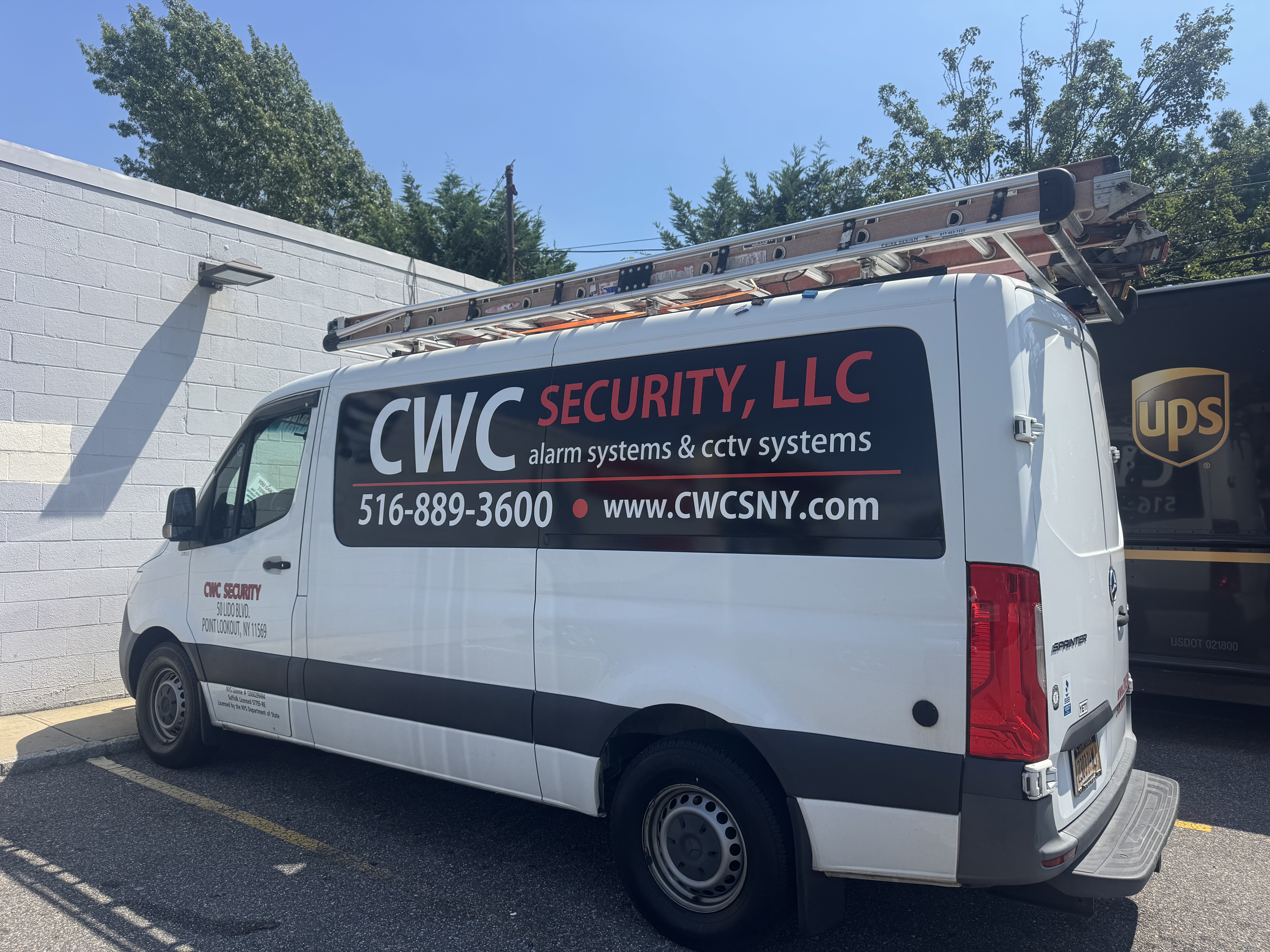 CWC Security branded service van with ladder rack, parked outside the Point Lookout office